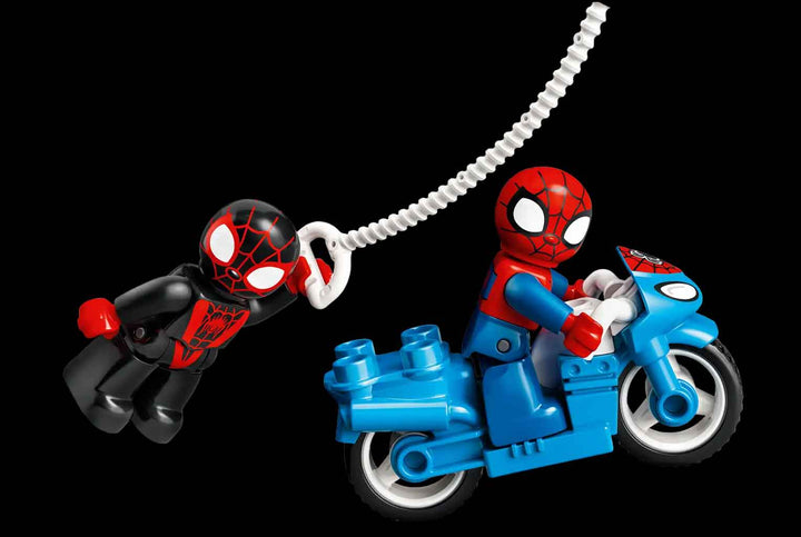 lego spider-man on blue motorcycle being chased 